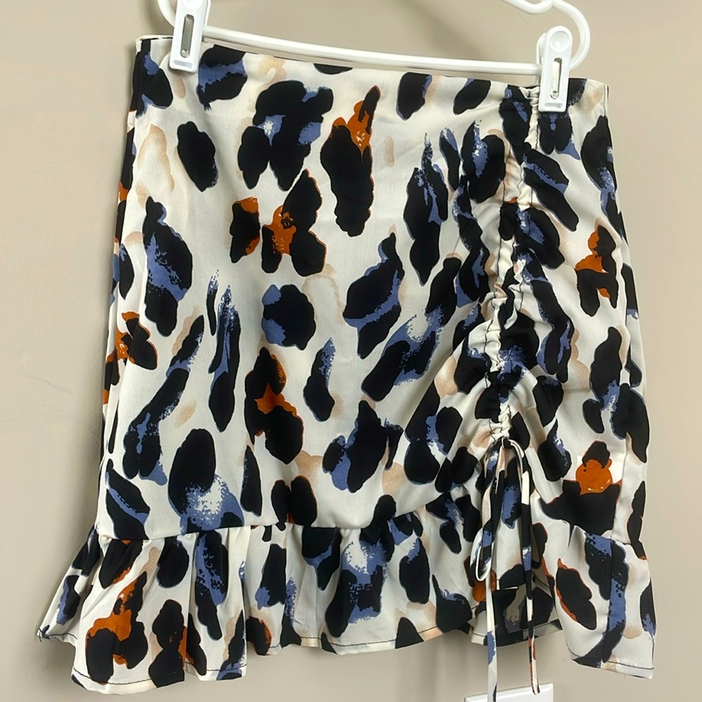 Small leopard print skirt with orange and blue accents